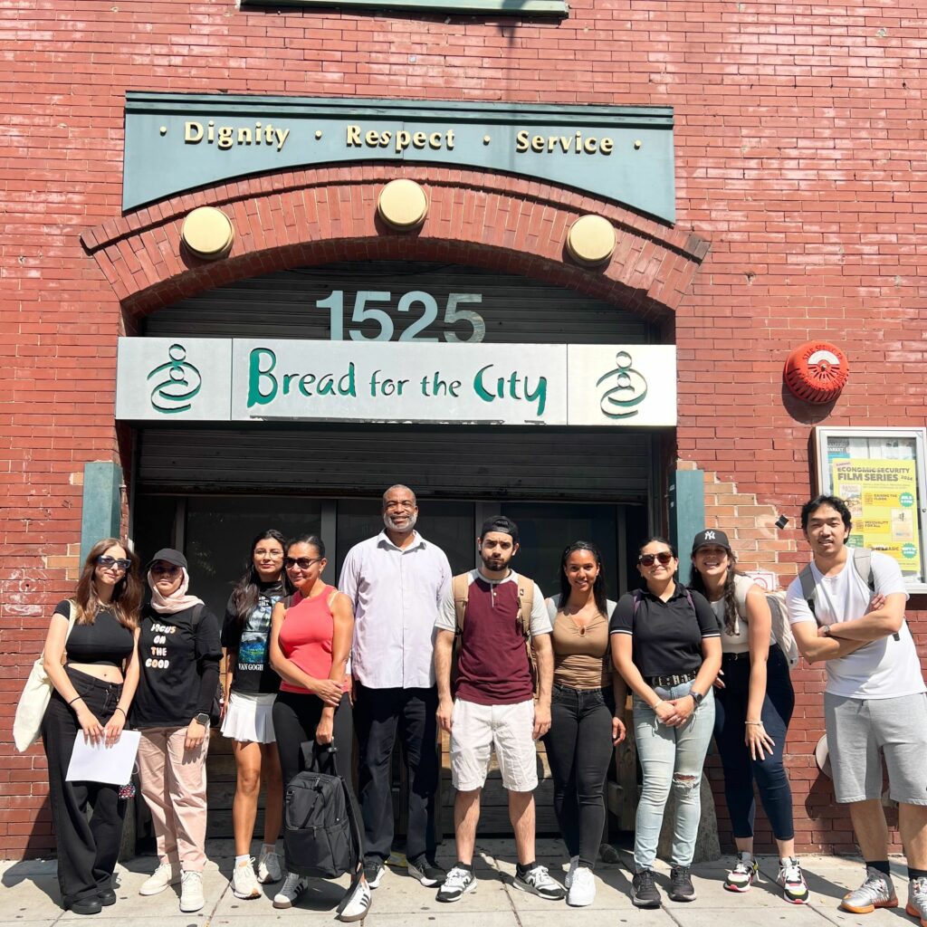 IMG_3249 Group of people outside Bread for the City building, promoting community service and support initiatives.