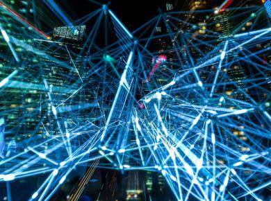 4 Types of Data Analytics and How Can they Help Businesses 16 Abstract digital network of blue neon lines over city skyline, symbolizing connectivity and technology.