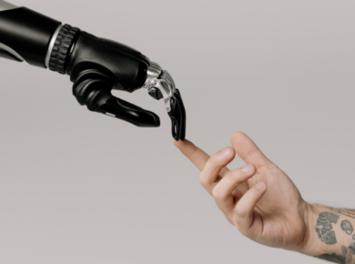 Best AI Jobs of the Future: How to Prepare for an Automated World 10 Robot hand and human hand touching fingers — artificial intelligence, human-robot collaboration, and AI jobs of the future concept.