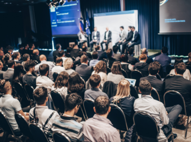 Business administration degreeseminar with students and professionals discussing career paths and industry insights.