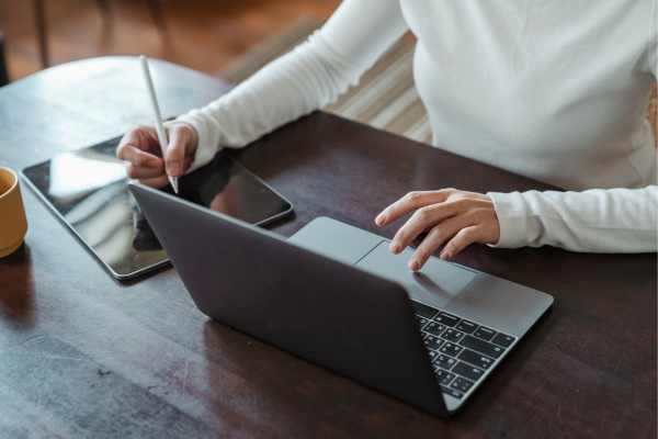 Entrepreneur working on a laptop, representing business administration graduates launching startups and small businesses.