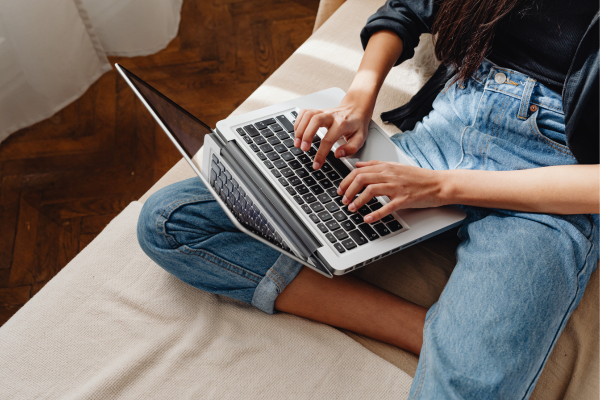 Student working on a laptop from home, representing flexible online master’s programs at a university