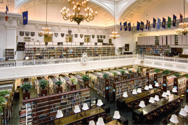 Interior of the DAR Library in Washington, D.C., showcasing its grand reading room, ornate chandeliers, and multi-level book collections. Photo courtesy of www.dar.org.