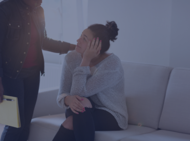 Why Mental Health Support Matters for International Students 11 A supportive friend providing mental health support to their friend sitting on a coach.