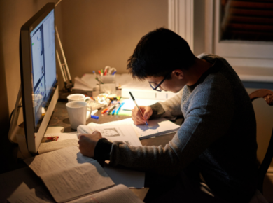 Balancing Study and Social Life: Tips for STEM and Business Students 26 Young man studying at a desk with a computer like stem and business students do