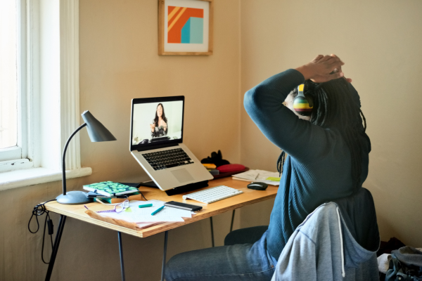 Remote Internships for Students: How to Turn Experience into a Career 11 A student attending an online meeting from a home office setup, highlighting virtual collaboration and the growing trend of remote internships.