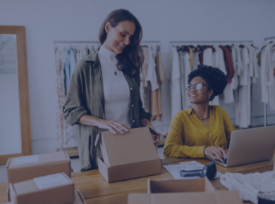 The Rise of Social Entrepreneurship: Combining Business with Purpose 55 Two women working together in a small social entrepreneurship business, packing products into cardboard boxes in a studio workspace.
