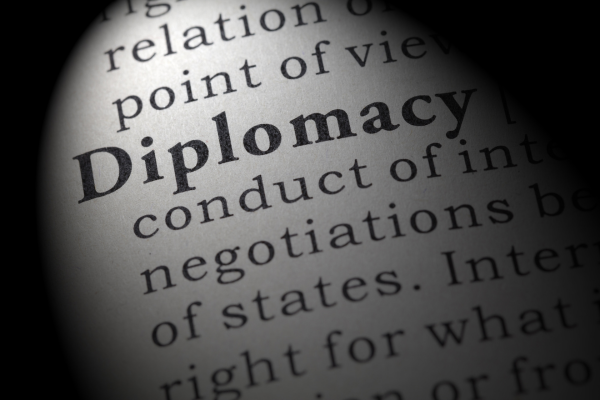 Diplomacy in the 21st Century: New Skills for a Globalized World 5 Close-up of the word Diplomacy in a dictionary, symbolizing international relations and negotiation skills.