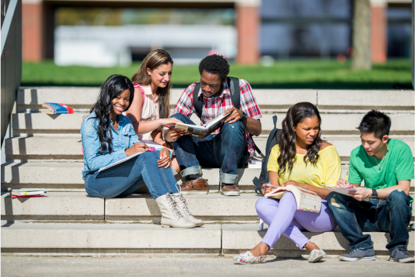 Why Washington, D.C. Is One of the Best Cities for International Students 6 Group of students studying together on outdoor steps, reading books and notes.