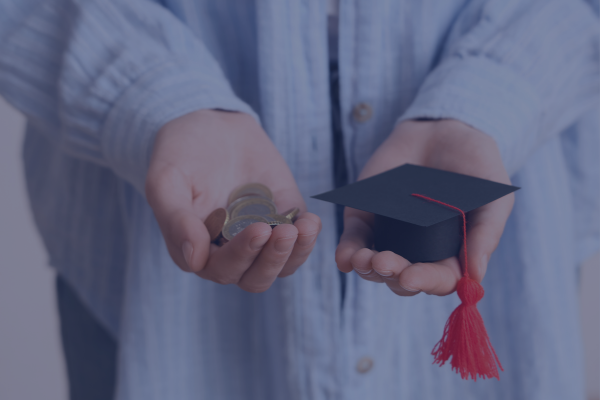 Is Debt-Free Education Possible in the United States? 1 A person holding coins in one hand and a miniature graduation cap in the other, symbolizing the balance of financial planning and achieving a debt-free education.