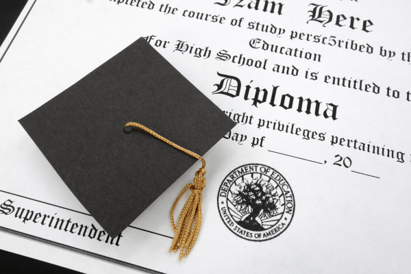 Cybersecurity Management: Why a Master's Degree is the Key to Senior Executive Roles 11 High school diploma with black graduation cap and golden tassel, symbolizing educational achievement and success.