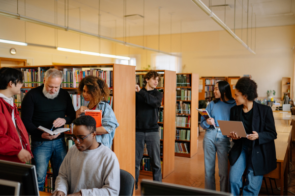 How University Innovation Centers Drive Student Entrepreneurship 8 University students researching and developing ideas in library, supporting innovation and academic growth