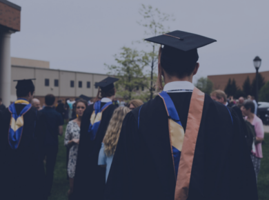 Is Your Degree Worth the Cost? Understanding the ROI of Education in the US 35 Graduates in caps and gowns gather outdoors, celebrating commencement with family and friends.