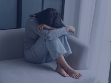 10 Strategies for Overcoming Culture Shock while Studying Abroad in 2026 48 A person sitting on a couch with head down, reflecting sadness of a culture shock faced while studying abroad