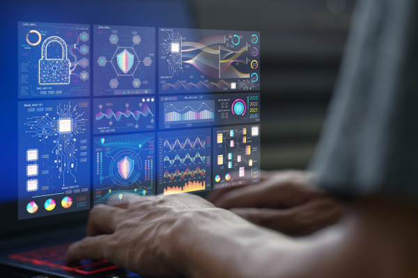Understanding Cybersecurity Frameworks: Essential Cybersecurity Certification Tips 10 Person analyzing cybersecurity data and charts on a computer screen, focusing on digital security and analytics.