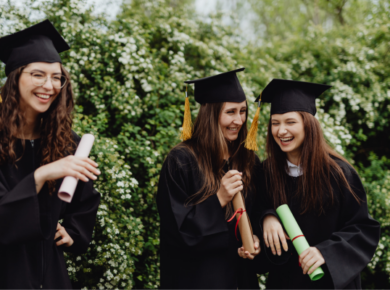 Why Donate to STEM Education? The Ripple Effect of Giving 53 Happy graduates in caps and gowns celebrate with diplomas in hand, standing outdoors amidst greenery.
