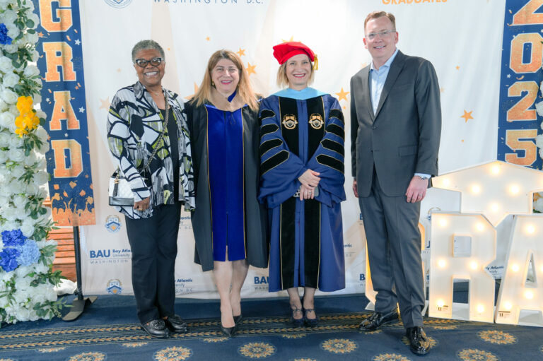 Group of four people at the Bay Atlantic University 2023 graduation ceremony in Washington, D.C.