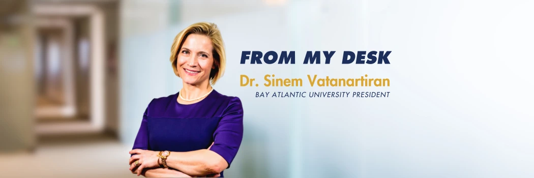 Smiling woman in purple attire, arms crossed, From My Desk text above, Bay Atlantic University President caption.