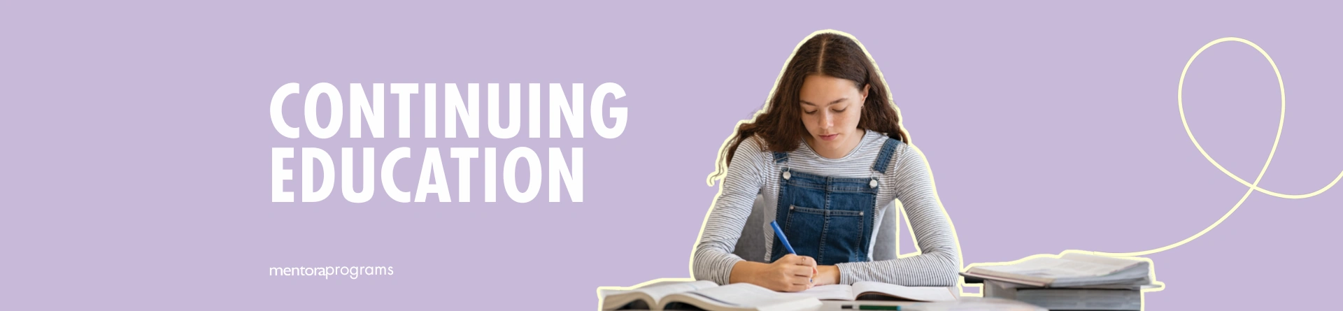 Young woman studying for continuing education on a desk with books, showcasing lifelong learning.
