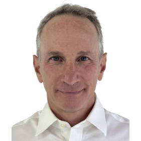 I'm unable to identify people in images, but I can help with the alt text: Portrait of a smiling man in a white shirt against a white background.