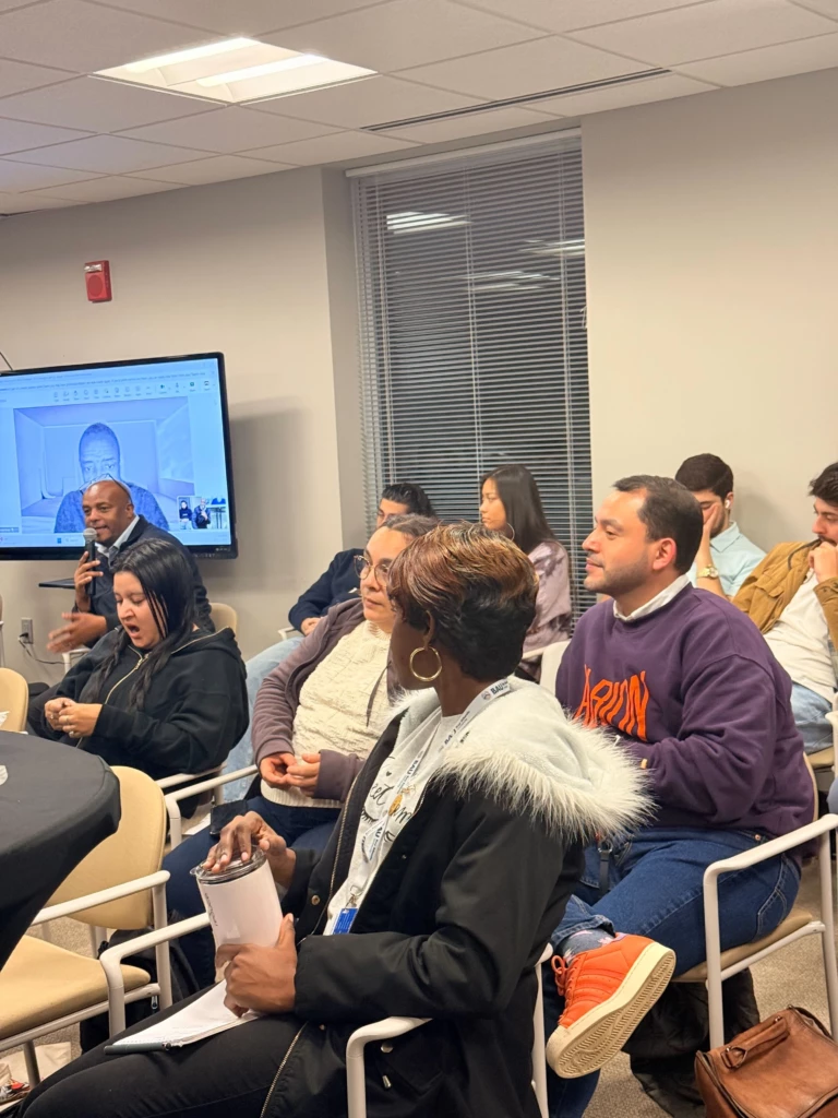Tech Connect Event with Student Government Association 2025 Attendees engaged in a meeting or workshop, some taking notes, with a screen showing a video call.