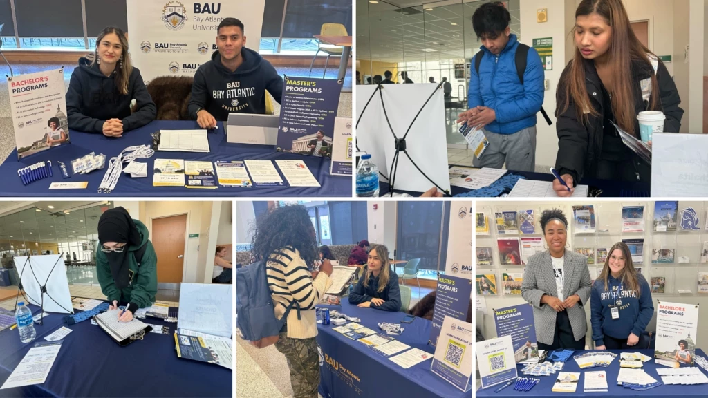 Students attending college information fair, exploring Bay Atlantic University programs at a promotional booth.