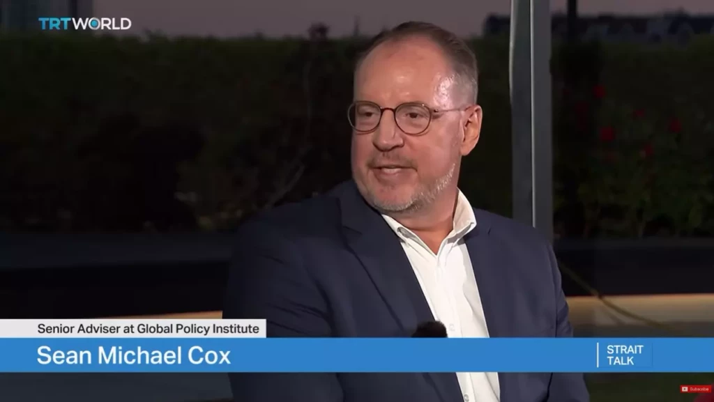 A close-up shot of Dr. Sean Michael Cox speaking on TRT World's Strait Talk broadcast. The on-screen graphic identifies him as Sean Michael Cox, Senior Adviser at Global Policy Institute.